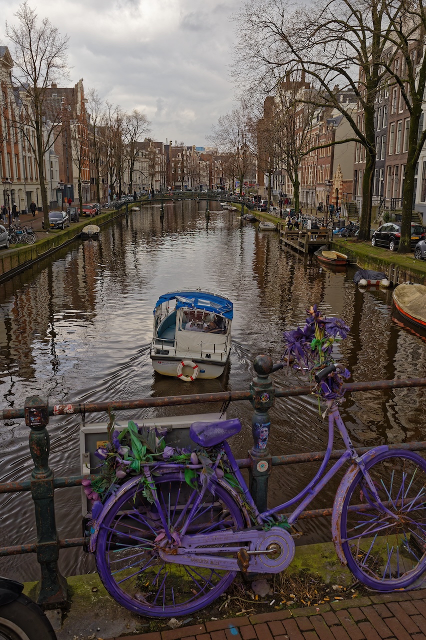 Canal in Amsterdam with boat and bike